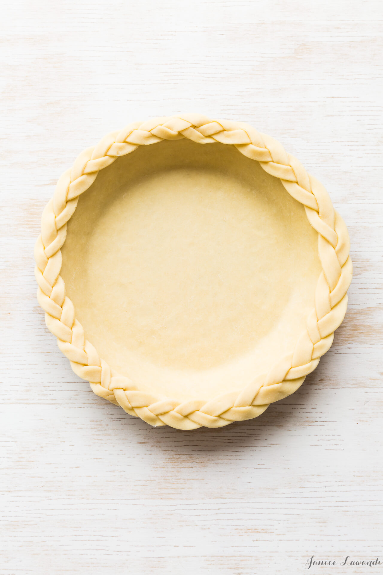 Unbaked pie shell made from an easy all-butter pie dough recipe that you put together in the food processor